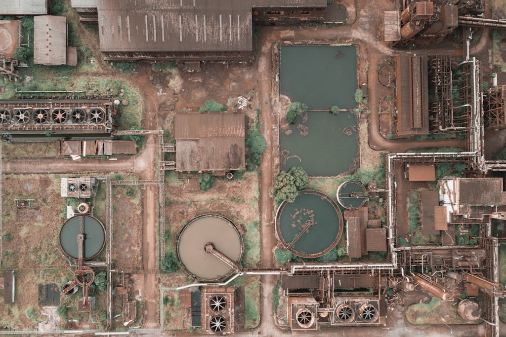 Drone view of an industrial facility in Kemaman, Malaysia, showcasing tanks and machinery.